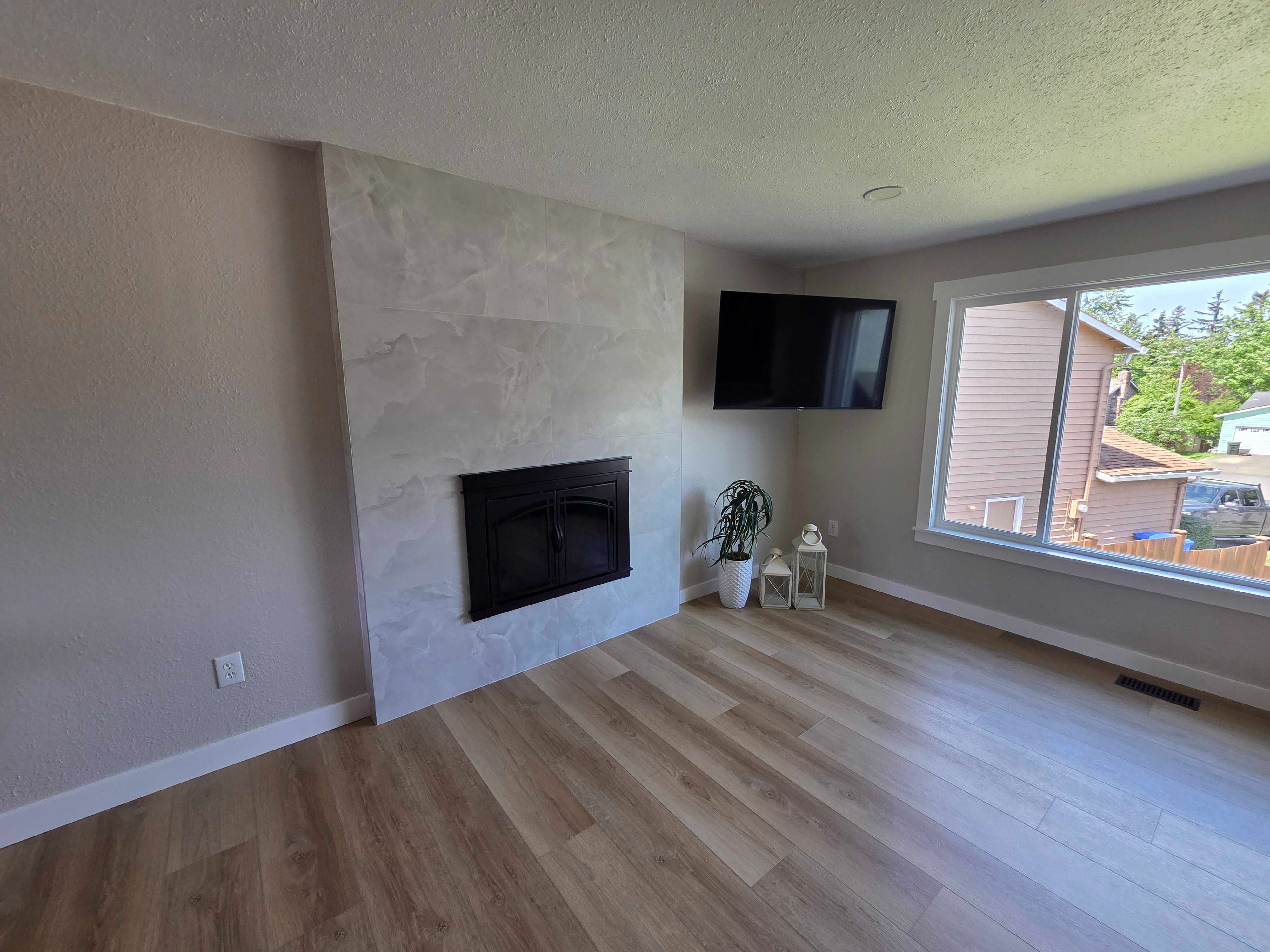 Living Room LVP & Fireplace — Prime Floors LLC project in King and Pierce County, WA